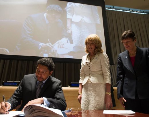 SVGs ambassador to the United Nations, Camillo Gonsalves, signs the U.N. Arms Trade Treaty as Patricia O'Brien, United Nations Legal Counsel, and Angela Kane, U.N. High Representative for Disarmament Affairs, look on. (Photo courtesy SVG U.N. Mission)