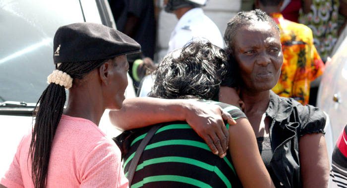The mother of murder victim Stephanie Daniel (centre) consoles another of her daughters outside the High Court in Kingstown on Friday, June 7, 2013. (IWN photo)