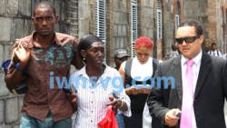 Dwaine Sandy, left, is seen with his mother, Margaret Sandy, and lawyer, Grant Connell, shortly after Sandy was released from police custody on Wednesday, June 19, 2013. (IWN photo)