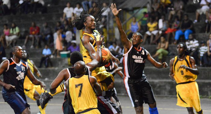 Ishama McKree of Calliaqua United attempts a basket amidst tough defence from Bequia United in the finals of the Mens Basketball Championship at the New Montrose Basketball Facility on Sunday, June 16, 2012. (Photo: Edward Newman)