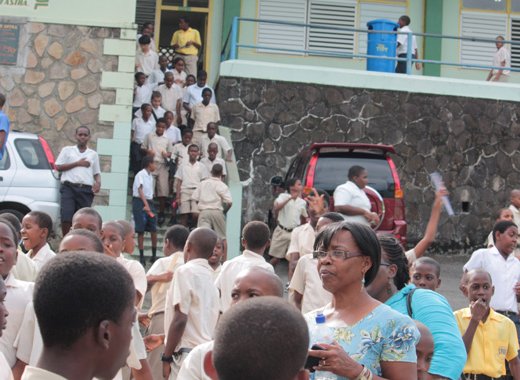 Students file out of the St. Vincent Grammar School in Kingstown after writing the Common Entrance Exam on Friday, June 7, 2013. (IWN photo)