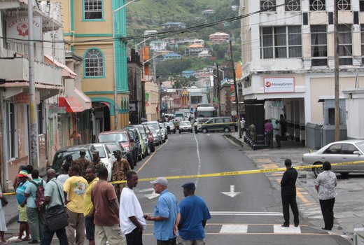 A postal worker was robbed of  EX$100,000 and a police officer shot in Kingstown on June 13, 2013. (IWN photo)