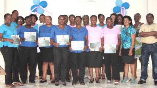 Graduates of the garment construction course with facilitator Marilyn Chance-Shallow, second from right, and Ministry of Education officials. (IWN photo)