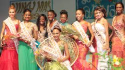 Miss Carival 2013, Miss Dominica, Leslassa Armour-Shillingford is surrounded by the other contestants in the pageant. 