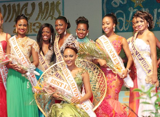 Miss Carival 2013, Miss Dominica, Leslassa Armour-Shillingford is surrounded by the other contestants in the pageant. 