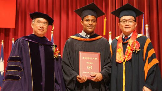Dr. Rosmond Adams, centre, and officials of the National Yang-Ming University in Taiwan . 