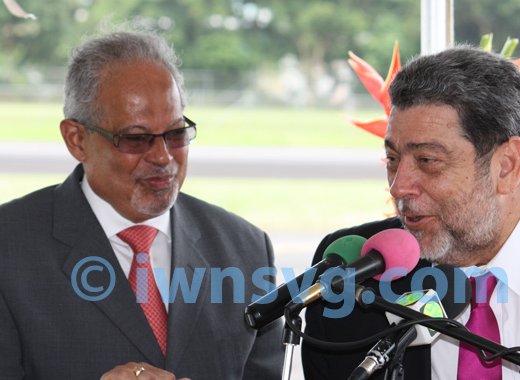 Prime Minister Dr. Ralph Gonsalves introduces Ian Brunton, chief executive officer of LIAT at a ceremony on in St. Vincent to welcome LIAT's first ATR aircraft to the country on June 26, 2013. 