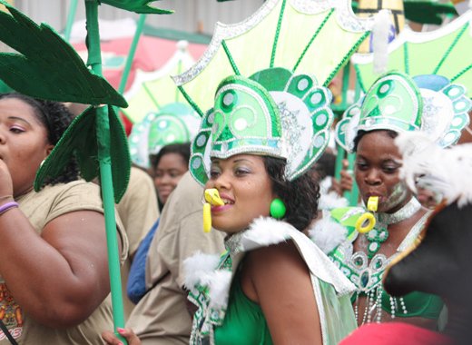 Masqueraders from Band of the Year 2013 winner, SVG Players International Mas Band, dance in Kingstown on Tuesday, July 10, 2013. Carnival planners say they are please with the outcome of the festival. (IWN photo)
