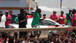 Carlisle Burke reacts after the key he picked during the luck draw opens the Mazda RX-8, making he cars his. (IWN photo)