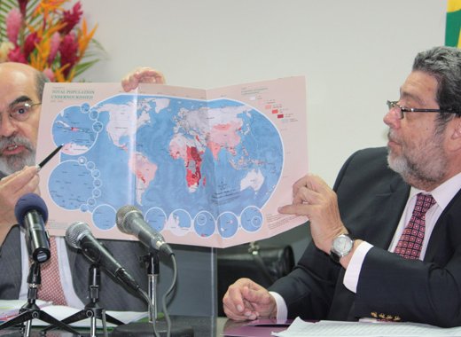 Director-General of the FAO, José Graziano da Silva, right, notes that on the FAOs map, St. Vincent and the Grenadines, is in white, among nations that have 5 per cent of their population undernourished. Prime Minister Dr. Ralph Gonsalves is at left. (IWN photo) 