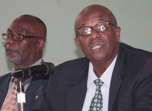 Vice-President of the New Democratic Party, St. Clair Leacock, left, and then party president, Arnhim Eustace at an NDP press conference in 2013. (IWN photo)