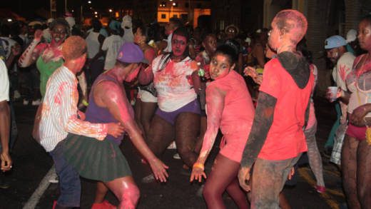 Revellers dance as Jouvert gets underway in Kingstown during the pre-dawn hours of Monday, July 8, 2013, amidst a watch for St. Vincent announced Sunday night. (IWN photo)