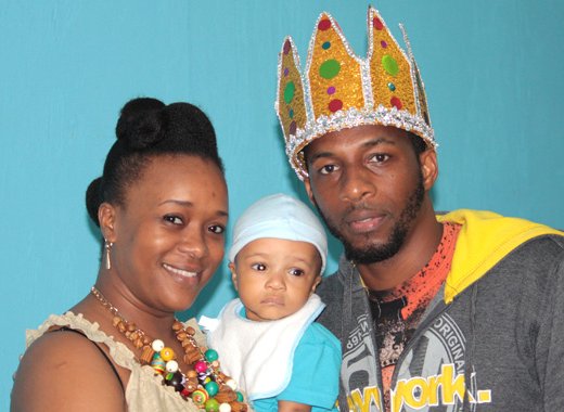 National Calypso Monarch Shernelle Skarpyon Williams poses with his wife, Natara Williams, and son, Orien Williams after the crowning Sunday night. (IWN photo)