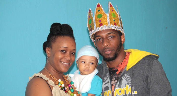 National Calypso Monarch Shernelle Skarpyon Williams poses with his wife, Natara Williams, and son, Orien Williams after the crowning Sunday night. (IWN photo)