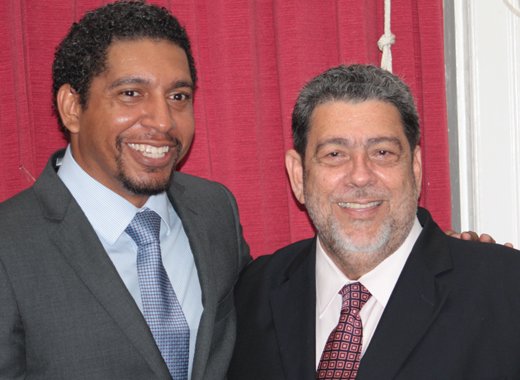 Sen. Camillo Gonsalves, left, and his father, Prime Minister Dr. Ralph Gonsalves. (IWN file photo)