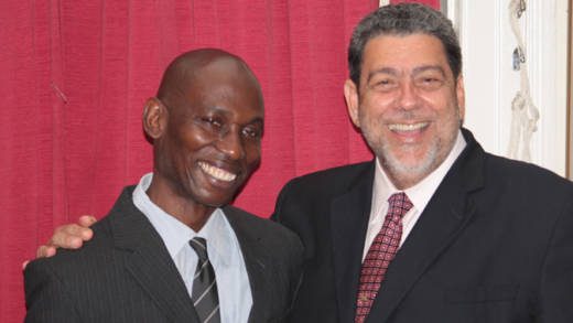 Jomo Thomas, left, and  Prime Minister Ralph Gonsalves in September 2013. (IWN photo)