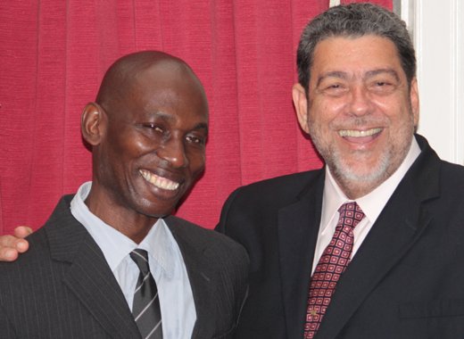 Jomo Thomas, left, and  Prime Minister Ralph Gonsalves in September 2013. (IWN photo)
