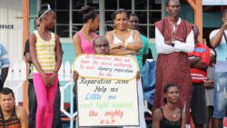Leon "Bigger Bigs" Samuel protests at the opening of the Reparations Conference last year. He was arrested in Kingstown on Monday. (IWN photo)