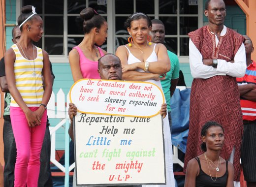 Leon "Bigger Bigs" Samuel protests at the opening of the Reparations Conference last year. He was arrested in Kingstown on Monday. (IWN photo)