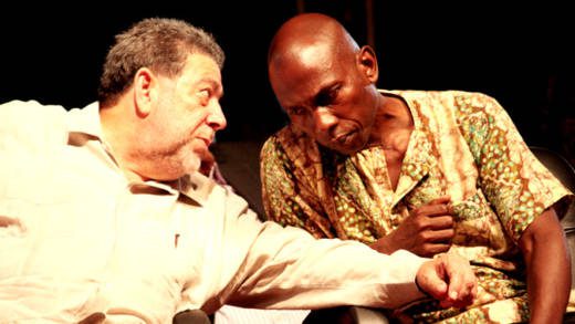 Prime Minister Dr. Ralph Gonsalves, right, and Sen. Jomo Thomas chat at the opening of the Regional Reparations Conference in Kingstown on Sunday, Sept. 15th, 2013. (IWN photo)