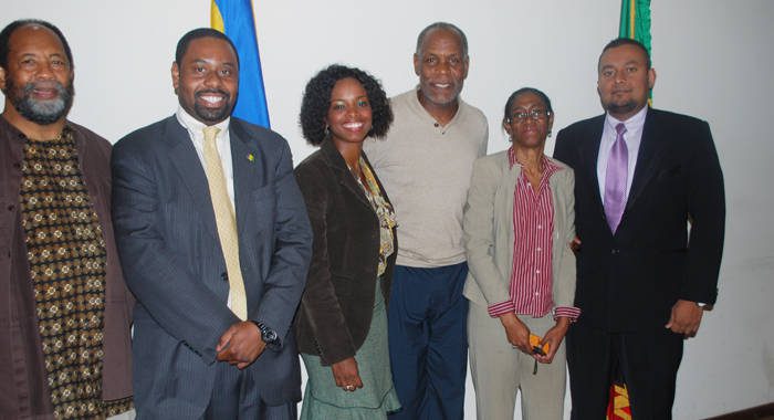 Ambassador Prince and some Embassy staff welcome Danny Glover and James Early.