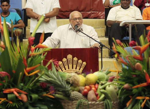 President of Guyana, Donald Romatar, is framed by agriculture décor as he addresses the opening ceremony of CWA 2013. (Photo: Kenton X. Chance)