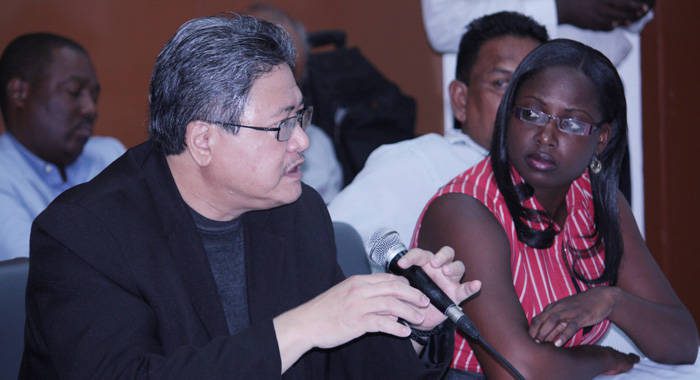 Orisha Joseph of Sustainable Grenadines Inc. listens as a Jamaican participant makes an intervention. 