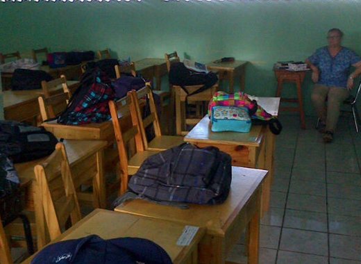 A teacher sits in a classroom while students protest at SJCK on Monday. (Photo: Z.S. Lewis/Facebook)