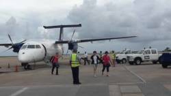 Passengers disembark the aircraft  after it landed in Barbados Wednesday afternoon. 