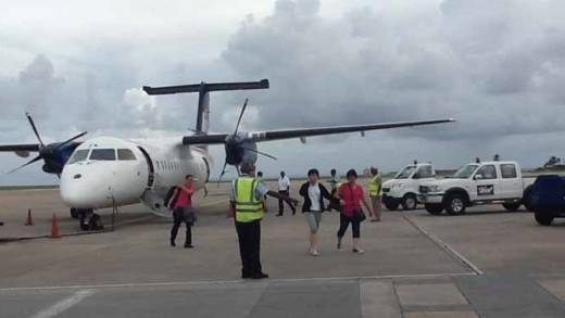 Passengers disembark the aircraft  after it landed in Barbados Wednesday afternoon. 