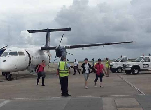 Passengers disembark the aircraft  after it landed in Barbados Wednesday afternoon. 