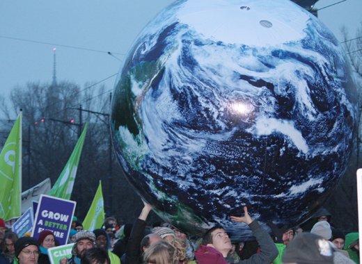 Environmentalists demonstrate in Warsaw on Saturday. Caribbean negotiators are in a precarious position as Japans revised its reduction emissions target. 