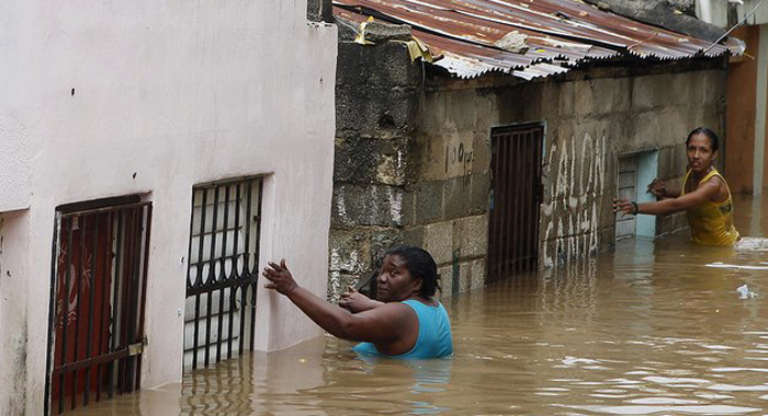 Hurricane Sandy PAP Haiti women in flooded street 102512