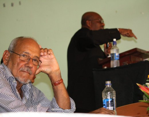 Sir James Mitchell at the NDP convention in 2010 as then party president, Arnhim Eustace delivers and address. The two have been hostile to each other publicly. (IWN photo)
