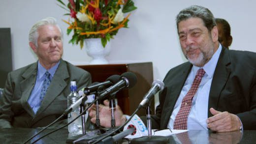 Jan Hartke of the Clinton Climate Initiative, left, and Prime Minister Dr. Ralph Gonsalves. (IWN photo)
