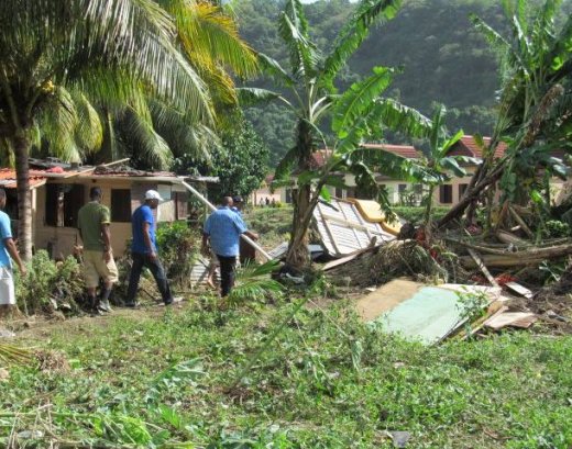 Oposition Leader Arnhim Eustace, right, leads an NDP delegation on a tour of the affected areas. (NDP photo)