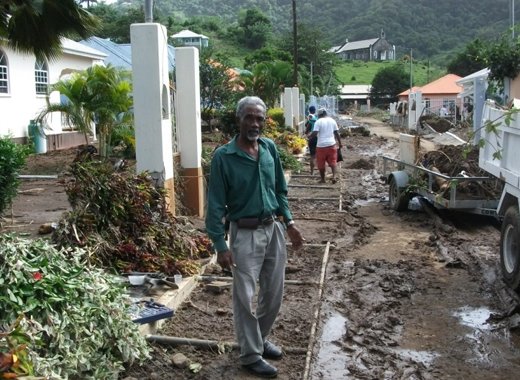 Ivan O'neal visits areas affected by floods. (Green Party photo)