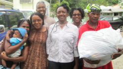 Members of the Thusia SDA church with one of the shelter managers, Ms  Mcdowall, center,  and a survivor assisting her in Buccament  Bay. (DRP photo)