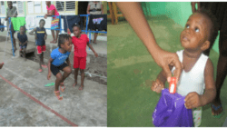 Left: Children play at the emergency shelter in Buccament Bay. Right: An infant survivor collects a goody bag, courtesy the DRP collaboration. (DRP photos)