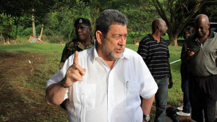 Prime Minister Ralph Gonsalves gestures as he leads government officials and the media on a tour of disaster areas on the Leeward (western) side of St. Vincent. (IWN photo) 