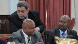 Prime Minister Ralph Gonsalves talks with Ministers of Tourism, Cecil McKie, left, and Fisheries, Saboto Caesar, right, in Parliament on Tuesday. There were increased fish landings, while tourism registered mixed results in 2013. (IWN photo) 