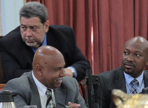 Prime Minister Ralph Gonsalves talks with Ministers of Tourism, Cecil McKie, left, and Fisheries, Saboto Caesar, right, in Parliament on Tuesday. There were increased fish landings, while tourism registered mixed results in 2013. (IWN photo) 