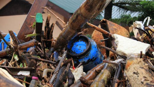 LPGs cylinder and other debris are deposited outside a house in Cane Grove. Prime Minister Ralph Gonsalves has called for generosity in the distribution of disaster relief. (IWN photo) 