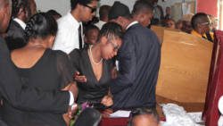 Nolisha Miller, centre, is consoled as she wept at the funeral on Saturday. (IWN photo)