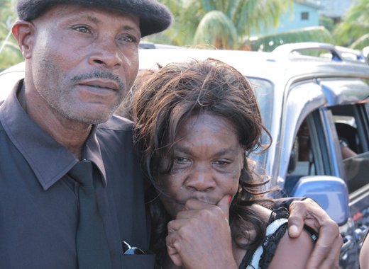 Stella James is consoled after the funeral service of her daughter, flood victim Keslia James on Saturday, Jan. 4, 2014. (IWN photo) 