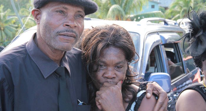 Stella James is consoled after the funeral service of her daughter, flood victim Keslia James on Saturday, Jan. 4, 2014. (IWN photo) 
