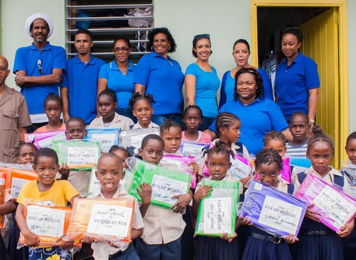 Members of Rise Up Bequia and students of the Fitz Hughes Primary School.