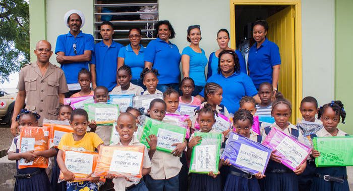Members of Rise Up Bequia and students of the Fitz Hughes Primary School.