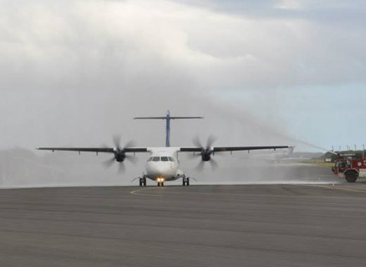 The LIAT aircraft receives the traditional spraying of water as it arrives in Antigua. (Photo: LIAT/Facebook)