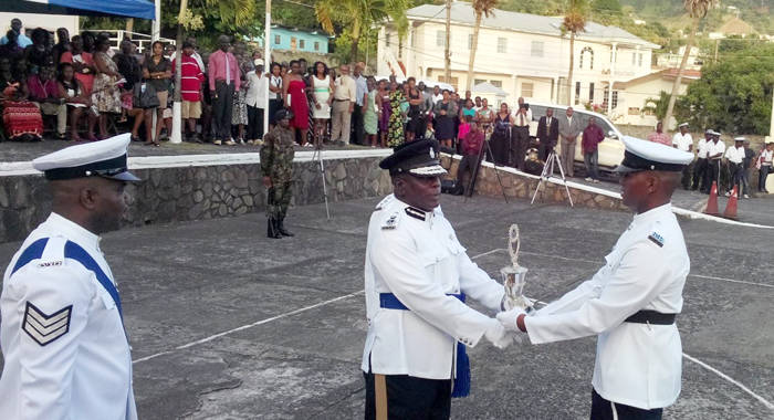Commissioner of Police Michael Charles presents and award at Thursday's Passing Out Parade. (Photo: Owen Baptiste)